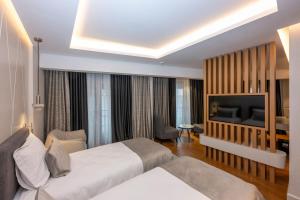 Postel nebo postele na pokoji v ubytování Baver Hotel