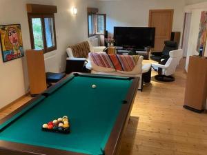 a living room with a pool table in a room at Guestroom Basse-sur-le-Rupt, 1 pièce, 2 personnes - FR-1-589-623 in Basse-sur-le-Rupt