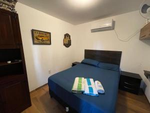 Ένα ή περισσότερα κρεβάτια σε δωμάτιο στο Monoambiente