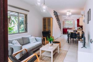 a living room with a couch and a table at Royal Townhouse in Center Paphos in Paphos City