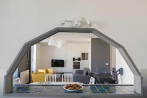 a view of a living room with a table and a living room at VOLVIC HOME in Volvic
