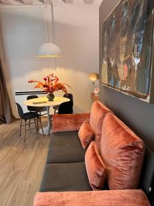 a living room with a couch and a table at LEONI DI COLLALTO PALACE in Treviso