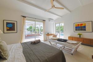 Ένα ή περισσότερα κρεβάτια σε δωμάτιο στο Magnifique villa rénovée neuve à Orient Bay +75 φωτογραφίες