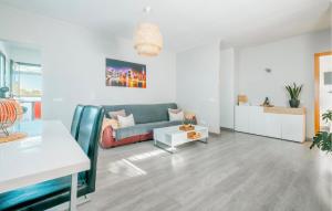 a living room with a couch and a table at Nice Home In Valldemar With Wifi in Gornal