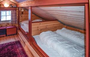 a room with two bunk beds in a cabin at Lovely Home In Geilo With Wifi in Geilo