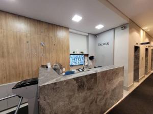 a lobby with a large counter in a store at De frente para o Guaíba. in Porto Alegre