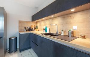a kitchen with a sink and a counter at Beautiful Home In Six-Fours-Les-Plages in Six-Fours-les-Plages
