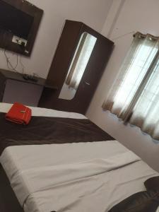 Ένα ή περισσότερα κρεβάτια σε δωμάτιο στο Hotel sambhodhi palace