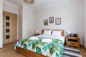 מיטה או מיטות בחדר ב-Marina Comfort Apartment