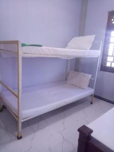 a couple of bunk beds in a room at Billiards villa in Trincomalee
