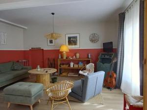 a living room with a couch and a table at Appartement Villard-de-Lans, 3 pièces, 5 personnes - FR-1-548-19 in Villard-de-Lans