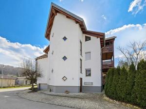 a white building with a wooden roof at Fully equipped apartments in Gerstetten in Gerstetten