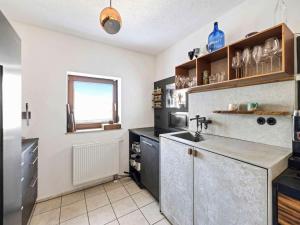 a kitchen with a sink and a counter top at Fully equipped apartments in Gerstetten in Gerstetten