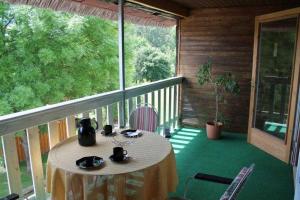 a table on the balcony of a house at Landhaus Damerow 2 in Federow