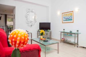 a living room with a couch and a table at La Manga Club 2 Bed Apartment Great location in Murcia