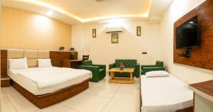 Postel nebo postele na pokoji v ubytování KK Residency + 7 fotografií