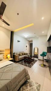 a bedroom with a bed and a living room at Luxury Loft - 20th Floor / River View in Noida