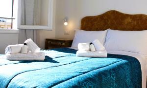 Ένα ή περισσότερα κρεβάτια σε δωμάτιο στο Linusa Home