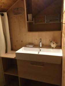 a bathroom with a sink and a mirror at Le Chant de la Rivière - Chalet 3 étoiles pour 8 personnes in Ventron