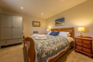 Ένα ή περισσότερα κρεβάτια σε δωμάτιο στο The Old Bunkhouse