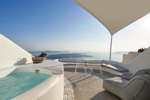 a view of a swimming pool on top of a house at Heavens Edge in Imerovigli