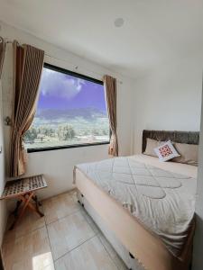 Postel nebo postele na pokoji v ubytování Tiga Mahkota homestay