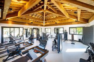 a gym with rows of exercise bikes and treadmills at APT 2 Quartos dentro de condo - Praia do Forte in Mata de Sao Joao +31 photos
