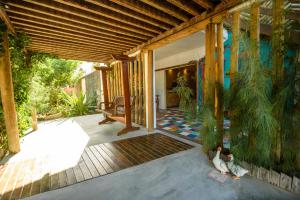 an outside view of a house with a porch at Villa Paihia Jericoacoara in Jericoacoara
