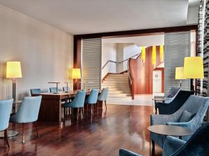 a dining room with a table and chairs at Sheraton Sopot Hotel in Sopot