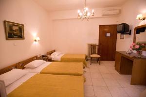Postel nebo postele na pokoji v ubytování Hotel Urania