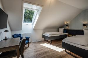 Postelja oz. postelje v sobi nastanitve Hotel Scheelsminde