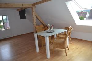 a dining room with a table and chairs at Ferienhaus Pfaffe in Traunstein