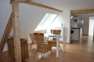 a kitchen and dining room with a table and chairs at Ferienhaus Pfaffe in Traunstein