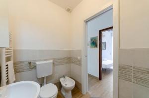 a bathroom with a toilet and a sink at Casa degli artisti 1 in Casarza Ligure +20 photos