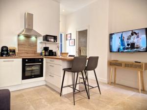 Kuchyň nebo kuchyňský kout v ubytování Les Capucins n°12 : APT4 pers