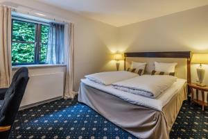 Postelja oz. postelje v sobi nastanitve Hotel Scheelsminde