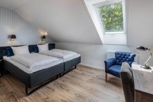 Postelja oz. postelje v sobi nastanitve Hotel Scheelsminde
