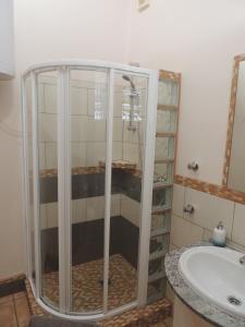 a bathroom with a shower and a sink at The Olive Mill in La Murada