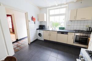 Køkken eller tekøkken på Herenhuis de Pastorie Groede