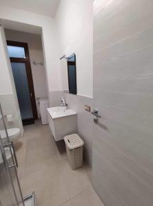 a bathroom with a sink and a toilet at CASA VACANZE CASANOVA in Agerola