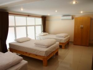 A bed or beds in a room at TOP Hostel