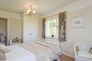 Llit o llits en una habitació de High Grassings Country House