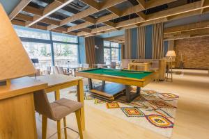 a billiard room with a pool table in a room at Aparthotel Phoenix in Bjelašnica