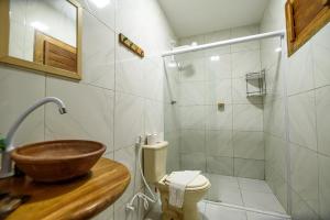 a bathroom with a sink and a toilet at Villa Paihia Jericoacoara in Jericoacoara +44 photos