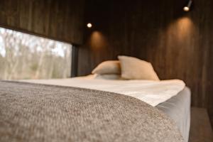 Llit o llits en una habitació de WoodHouse Denmark