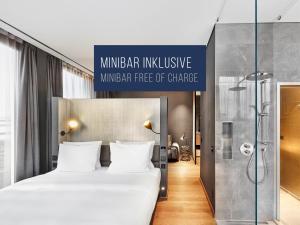 Voodi või voodid majutusasutuse HYPERION Hotel Leipzig toas