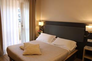 Postel nebo postele na pokoji v ubytování Hotel Victoria