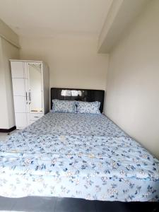 Łóżko lub łóżka w pokoju w obiekcie Sunda Kelapa View PSV Belize