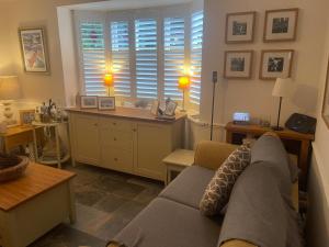 a living room with a couch and a desk at Morgraig in Cardiff