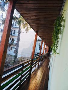 a wooden balcony with a view of a building at Central Hostel Cluj in Cluj-Napoca